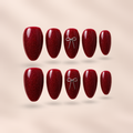 Merlot Charm – wine-red glitter jelly with silver 3D bow almond press-on nails by Verozi London