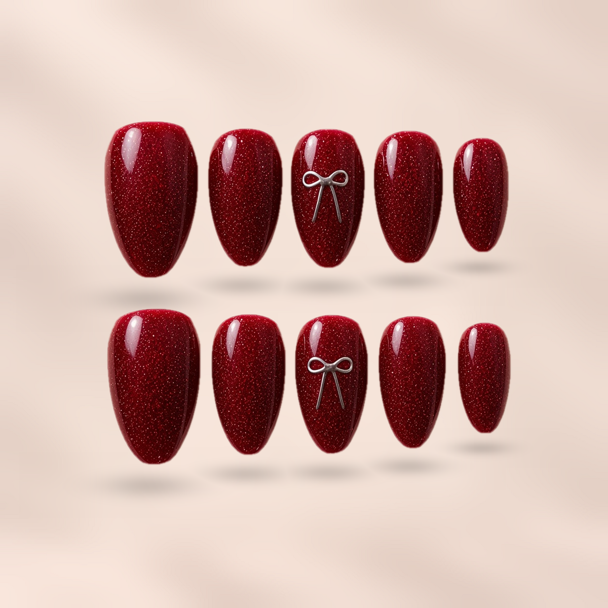 Merlot Charm – wine-red glitter jelly with silver 3D bow almond press-on nails by Verozi London