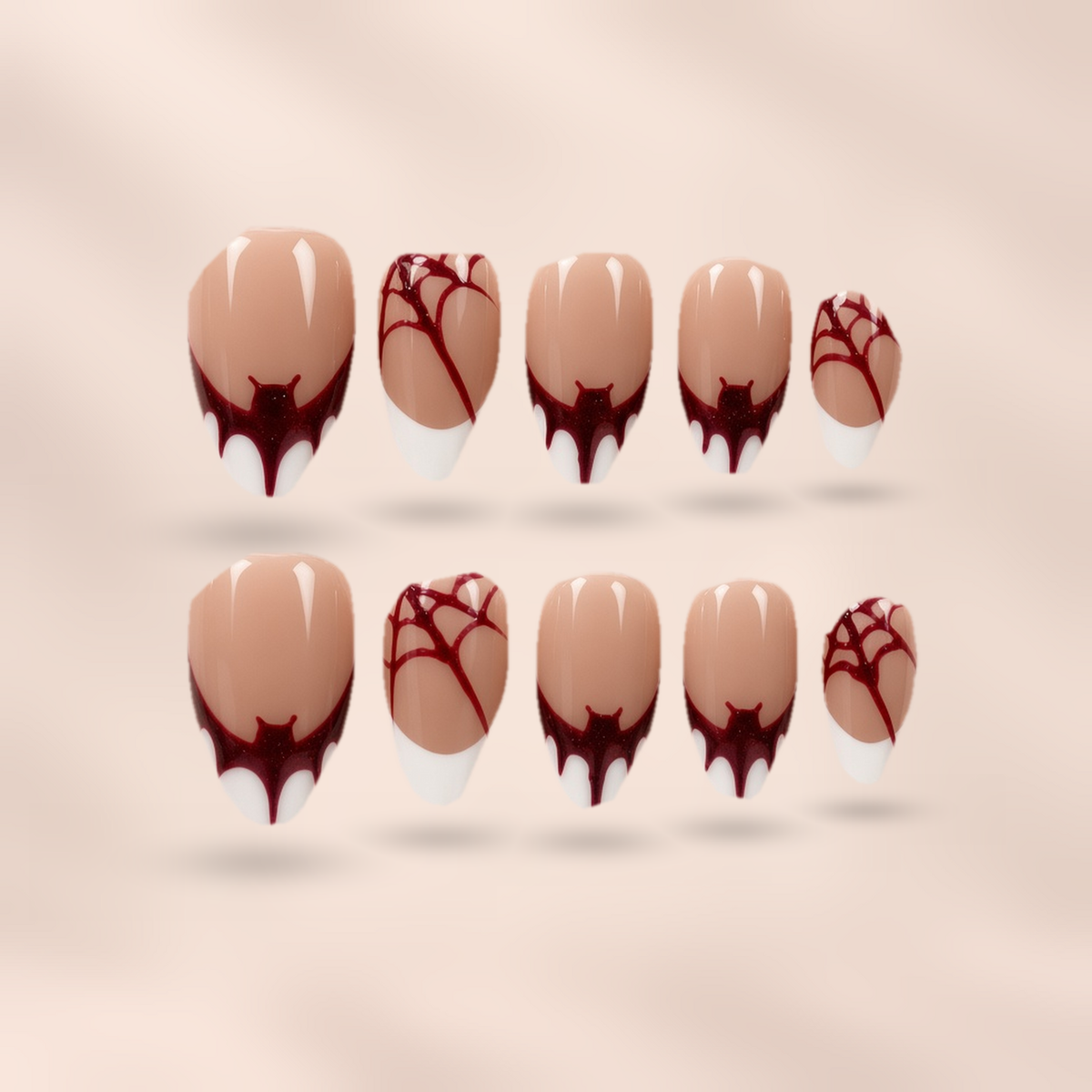 Spellbound – nude-beige with burgundy bat-wing tips and spider web accents almond press-on nails by Verozi London
